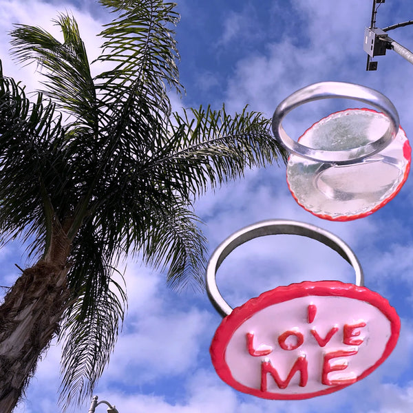 I LOVE ME Sterling Silver Gum-Ball Ring is handmade and hand-enameled and hand-signed--all right here in the good ole USA.Approximately 7/8” diameter. Come gift boxes and ready to give, or receive. Start with yourself and feel the love radiate back. If you love yourself, you will feel too good to even care.
