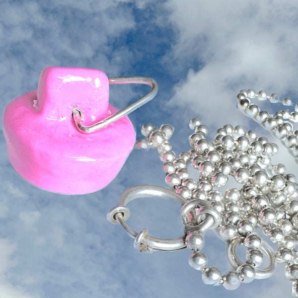 Nonbinary Sterling Silver Handmade, Hand-Enameled Barbie Pink Sink Stopper is 1" x 3/8" approximately and is hand-signed on the hollow inside. Comes with special gift wrapping--even if you are gifting yourself For the record, Pink has ALWAYS been my favorite color. I owned a pink house, had another house with a pink kitchen and a 1965 pink T-Bird.