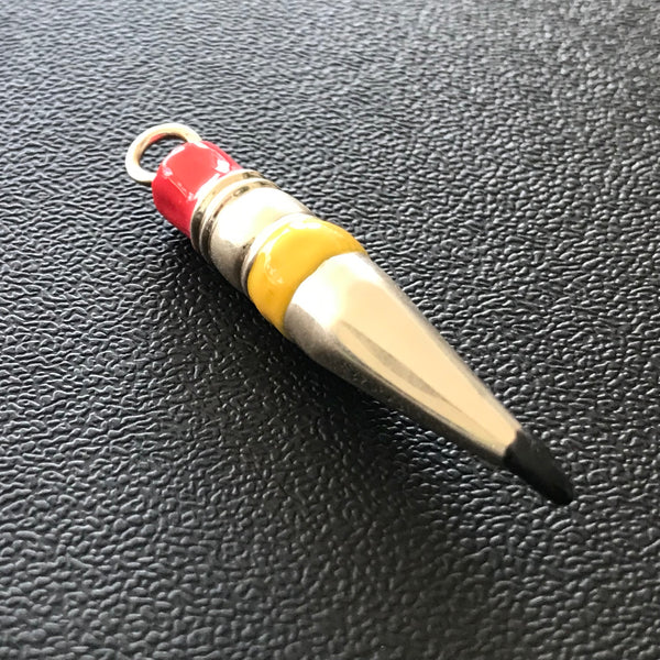 This Hand-Enameled Yellow Sterling Silver Pencil Nub Charm  is my ode to creative writers or all sorts.  Sterling Silver Pencil Nub Charm. Hand-Enameled Replica of a Yellow #2 wooden pencil with graphite tip--designed  Shiny ;925 Sterling Silver.Complete with Sterling Silver Chain. Gift Boxed in Fables Cotton Small Gift Bags. Hand Signed. A true labor of LOVE. 