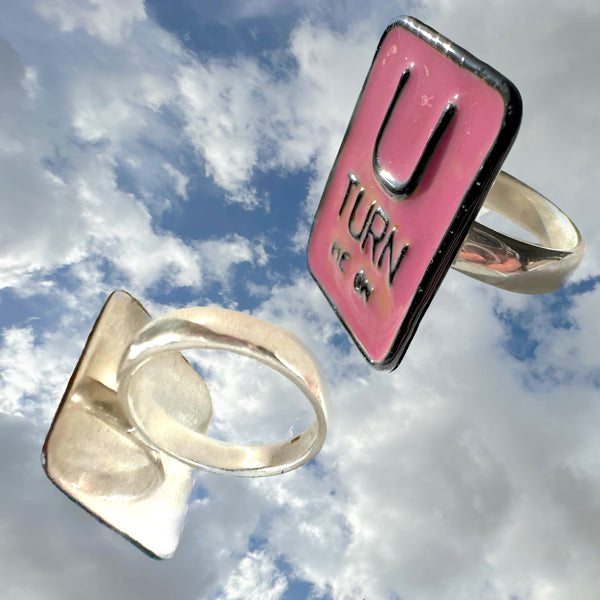 "U TURN Me On" POP ART Sterling Silverl Ring, Hand-enameled on Sterling Silver. Measures approximately 1" by 3/4". Handmade, Hand-Enameled and Hand-signed Here in the good ole USA! . Sizes 5-9 . Email me about larger sizes for an additional fee. Comes in branded cotton pouch, gift-boxed and ready to give, or receive! Who wouldn't want THIS Message?) 