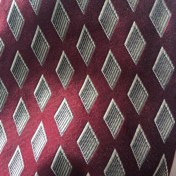 Fabric Swatch. Red and White Diamond Dandy Tie.The Dandy Tie. Each is a ONE OF A KIND and HANDMADE,by me, out of recycled neckties I handpick because of their texture or color or print. Created for men AND women, and designed to be worn for a lifetime, because of their timeless elegance, you are guaranteed to never see another like yours. Completely adjustable, the Dandy Tie is meant to be worn with or without a shirt. Use your own imagination!