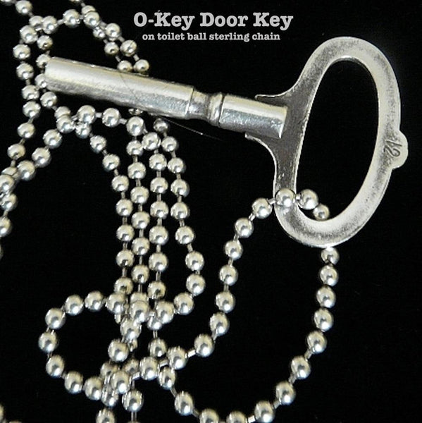 Sterling Silver O-Key. Measures approximately 1-7/8" across the long O top and 3" from top to bottom, this is a gorgeous, substantial piece, whether worn on the leather cord with which it comes, or on one of our special chains, or strung onto our luxurious 60" long Silver Pearls with heart clasp.  Vintage Satin Oxidized Finish makes it an instant heirloom. Handmade in the USA. Hand-signed.