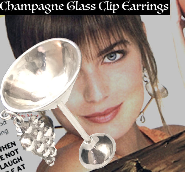 Sterling Silver Champagne Glass Earrings, with champagne bubbles top. (approx 2-1/4" h x 1-1/4" diameter cup) Also available as a Sterling Silver Charm--but don't worry, you won't have to drink alone...it is an "ice-breaker".   