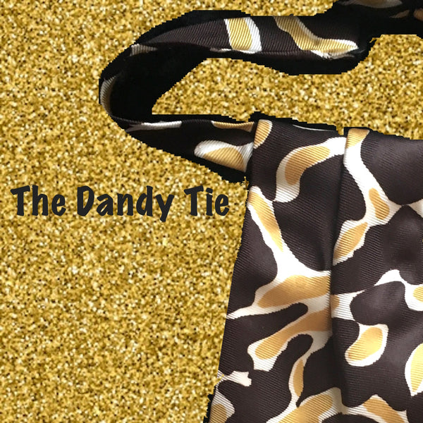 The Dandy Tie. Each is a ONE OF A KIND and HANDMADE,by me, out of recycled neckties I handpick because of their texture or color or print. Created for men AND women, and designed to be worn for a lifetime, because of their timeless elegance, you are guaranteed to never see another like yours. Completely adjustable, the Dandy Tie is meant to be worn with or without a shirt. Use your own imagination!
