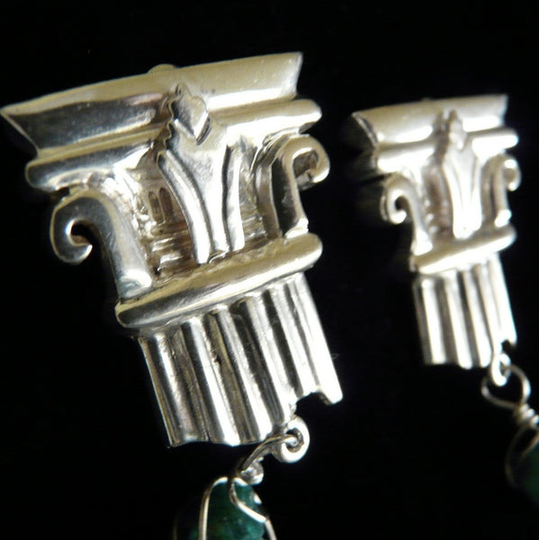 A more delicate version of my Sterling Silver Broken Column earring--THIS one is just the broken TOP, and dangling from it is a chunk of Jade... A more tailored earring for the less bold woman who still likes to make a statement. Perfect for day OR evening wear.   Approximately 1"x 1". Hand made in the USA. Hand signed.  Sterling Silver Broken Column Top Earrings with dangling chunks of Genuine Jade.