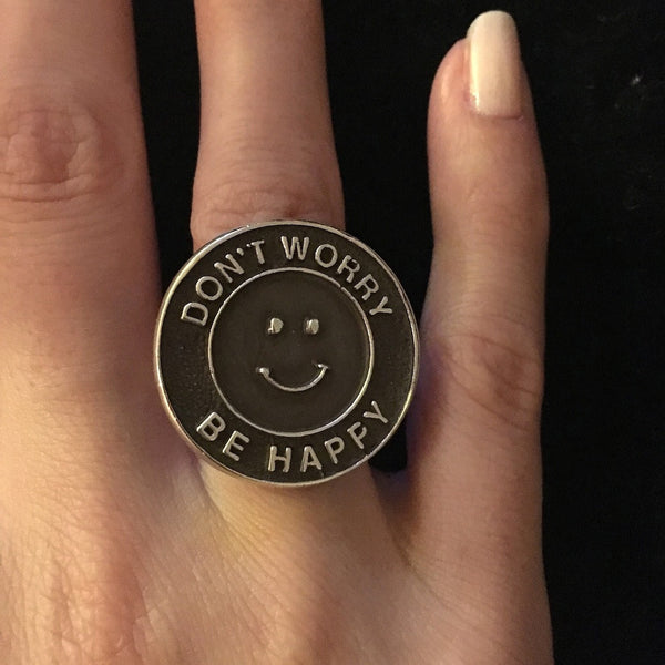 Fablesintheair.com's Don't Worry Be Happy Sterling Silver Ring.Hey, this could quickly become the slogan for the current state of our beautiful planet--Meher Baba knew the secret to a life well-lived, pre-Serenity Prayer.Get ready for a lot of smiles in your direction when they see this ring.  Approximately 1" diameter adjustable Sterling Silver Don't Worry Be Happy Gumball Ring. Made in America. Hand signed.  Don't Worry. Be Happy.