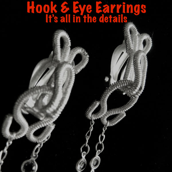 This earring reminds me of trapeze artists...the gentle swing of the coupled Silver braid hook and eye suspending dazzling fluid "thread". Here shown in Sterlin...