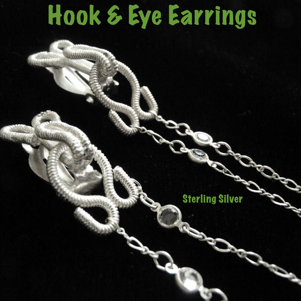 This earring reminds me of trapeze artists...the gentle swing of the coupled Silver braid hook and eye suspending dazzling fluid "thread". Here shown in Sterlin...
