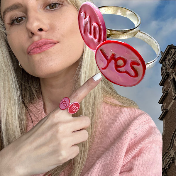 Love to make a controversial splash with your accessories? Sterling Silver YES or NO Enameled Gum-Ball Rings. Approximately 5/8” diameter. Handmade, Hand-enameled and Hand-Signed here in the good ole USA. Also available as Earrings, Cufflinks and Charm! The decision is YOURS ! Model: Paris Carney