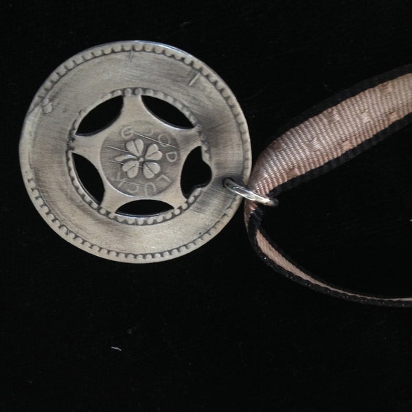Remember those old machines at the amusement parks where you could get these in aluminum and engrave them with your boyfriend's name? Well, here's the "Sterling" version and you can take a trip down memory lane and have it engraved with a special message to someone meaningful to you. 1-1/4" diameter. Lucky Charm comes with black leather cord. Feeling LUCKY, or WANT to feel lucky? In these challenging economic times, the term "A wish and a prayer" take on more significance and I just love the optimism which 