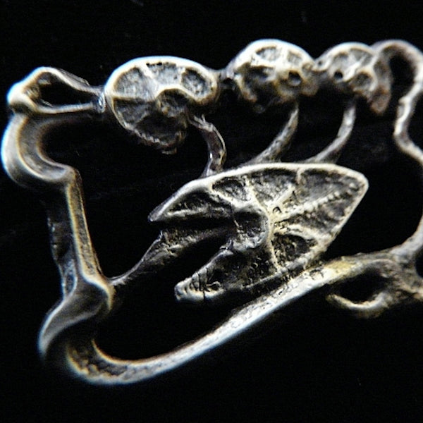 This is one Lily Pad which requires no frog-to-prince to transform its wearer to beautiful maiden status. Slide wired ribbon, leather cord or delicate chains and it becomes a different necklace.