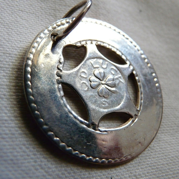 Remember those old machines at the amusement parks where you could get these in aluminum and engrave them with your boyfriend's name? Well, here's the "Sterling" version and you can take a trip down memory lane and have it engraved with a special message to someone meaningful to you. 1-1/4" diameter. Lucky Charm comes with black leather cord. Feeling LUCKY, or WANT to feel lucky? In these challenging economic times, the term "A wish and a prayer" take on more significance and I just love the optimism which 