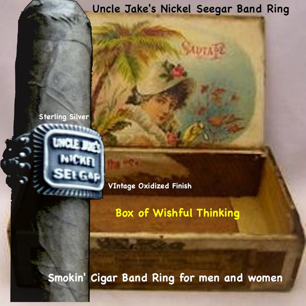 Even if you are not a cigar aficionado, this vintage cigar band ring is "smoking". The first in what will be an expansive and whimsical collection,  this 3D version of an actual antique "Seegar" band--the first of its kind. Sterling Silver in my antique satin oxidized finish to bring the old cigar band to life once again!  Top 1/2" wide approximately.  Made in the USA by hand. Hand signed.  Sterling Silver Uncle Jake's Nickel Seegar Cigar Band Ring.  Be sure to check out my other two cigar band rings--Mild 