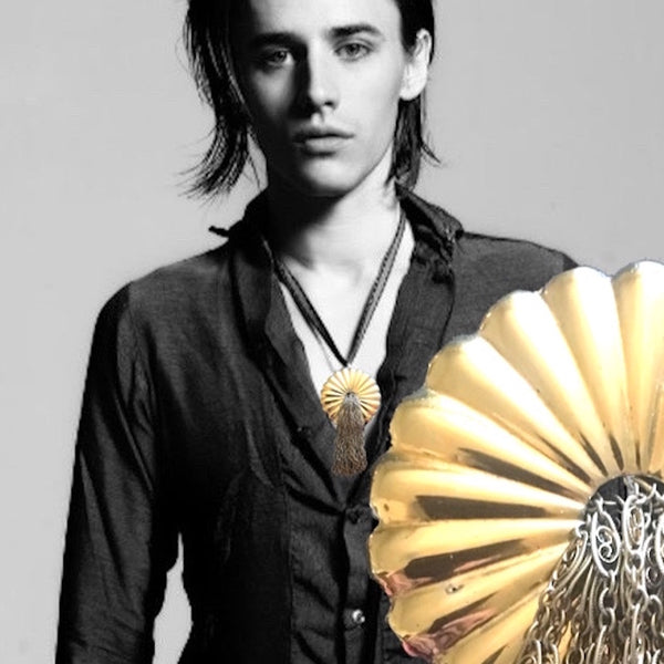 Reeve Carney of Hadestown and Penny Dreadful. This piece is all about curves, reflection and movement. Sounds like the life-path, eh? Let's go with that. Vintage looking Fluted Large Circle \ (2" diameter) with another smaller circle in the center, from which fllows a beautiful, finely- detailed Sterling Silver fountain of fluid chains