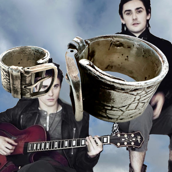Substantial piece of pure vintage rock and roll--as seen on Zane Carney, in Avril Lavigne's  "I Fell in Love with the Devil"Music Video.. Opulent,finely detailed band of timeless whimsy in Oxidized Sterling Silver Buckle Ring makes a statement alone or as part of a collection of fables...Sterling Silver distressed Crocodile textured buckle ring. Handmade in America and Hand-signed.