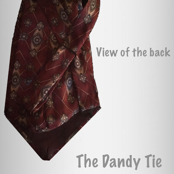 The Dandy Tie.  Each is a ONE OF A KIND and HANDMADE,by me, out of recycled neckties I handpick because of their texture or color or print. Created for men AND women, and designed to be worn for a lifetime, because of their timeless elegance, you are guaranteed to never see another like yours. Completely adjustable, the Dandy Tie is meant to be worn with or without a shirt. Use your own imagination!