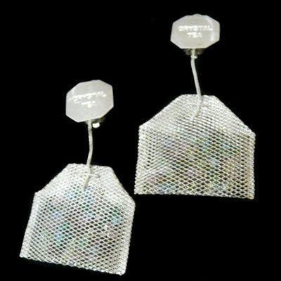 Sterling Silver mesh teabags filled with Austrian Crystals, hanging by a sterling silver foxtail "thread" from a Sterling Silver "Paper" "Crystal Tea" tag.3" x 1-5/8" approximately  Handmade in the USA. Hand Signed